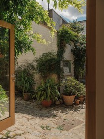 The Old Dairy - exposed brick wood paneling courtyard cobblestone french doors industrial modern gym rustic modern shabby chic - thumbnail