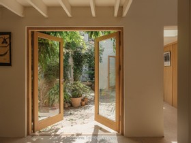 The Old Dairy - exposed brick wood paneling courtyard cobblestone french doors industrial modern gym rustic modern shabby chic - thumbnail