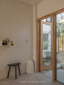 The Old Dairy - exposed brick wood paneling courtyard cobblestone french doors industrial modern gym rustic modern shabby chic - thumbnail